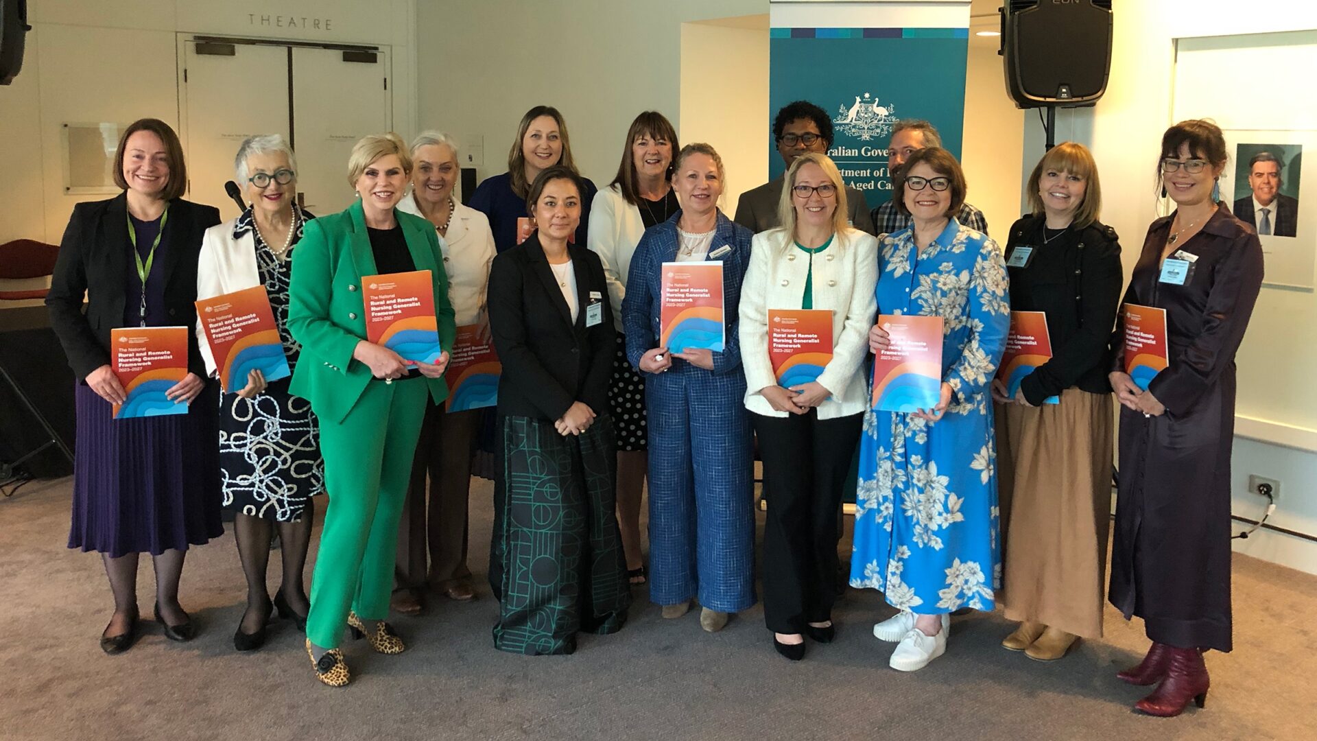 IMG_3078 Group of people standing and holding the National Rural and Remote Nursing Generalist Framework