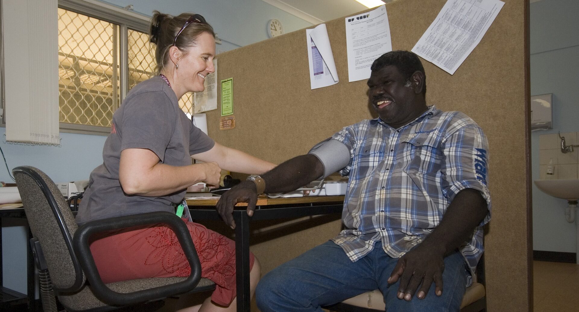 Vanessa taking a patient's blood pressure