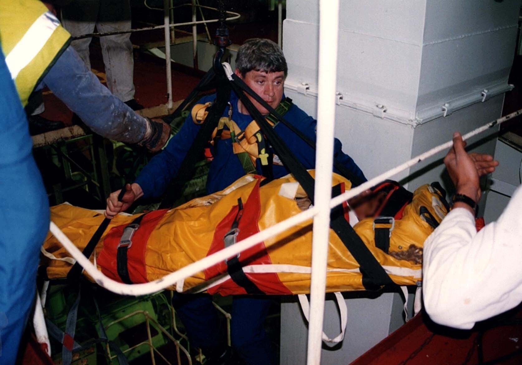 Ken removing an injured seaman from the hold of a vessel off Newcastle.